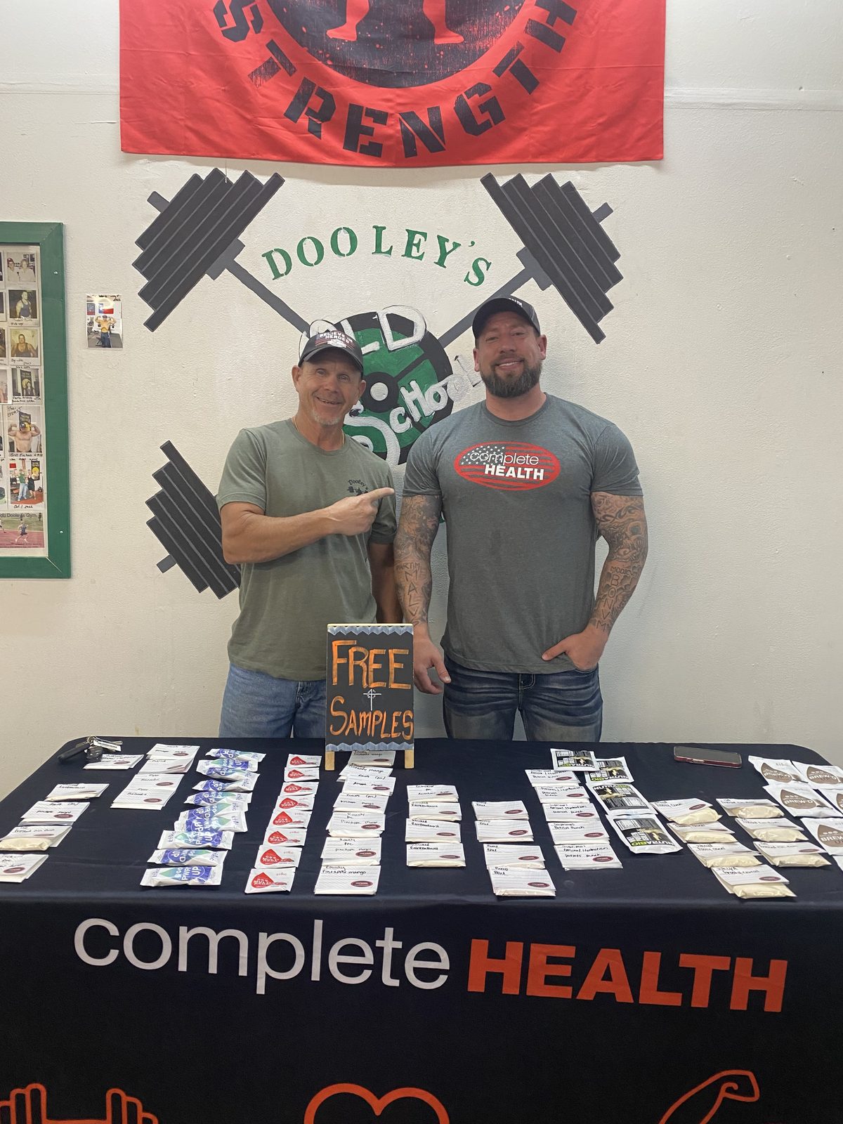 Jim Dooley and a local wellness partner at a community table