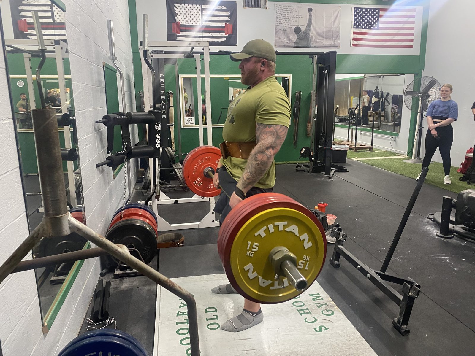 A member completing a heavy deadlift at Dooley’s