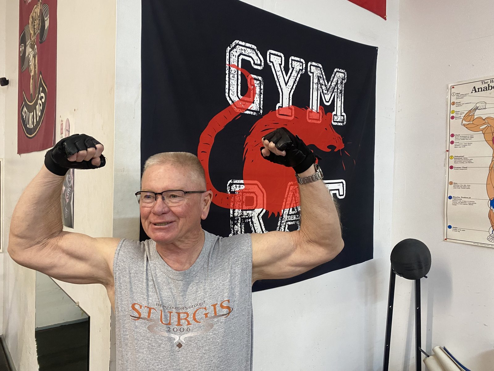 A longtime member flexing inside Dooley’s gym