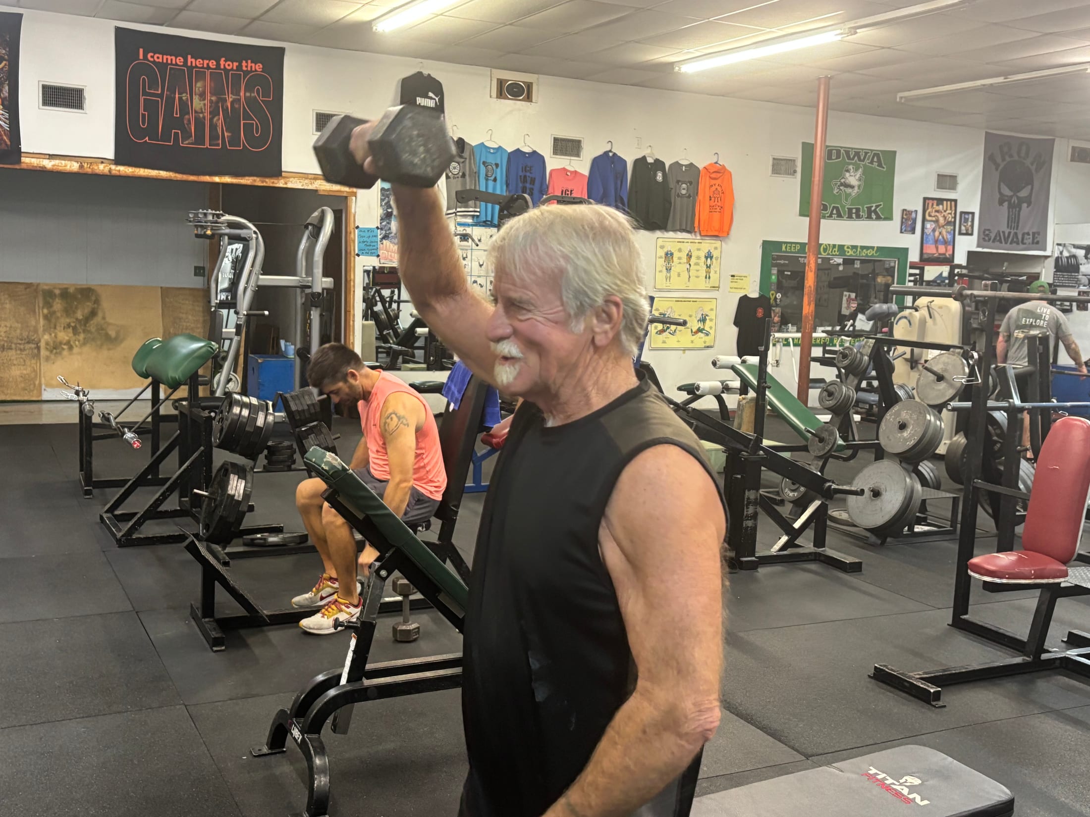 A member training with a dumbbell at Dooley’s