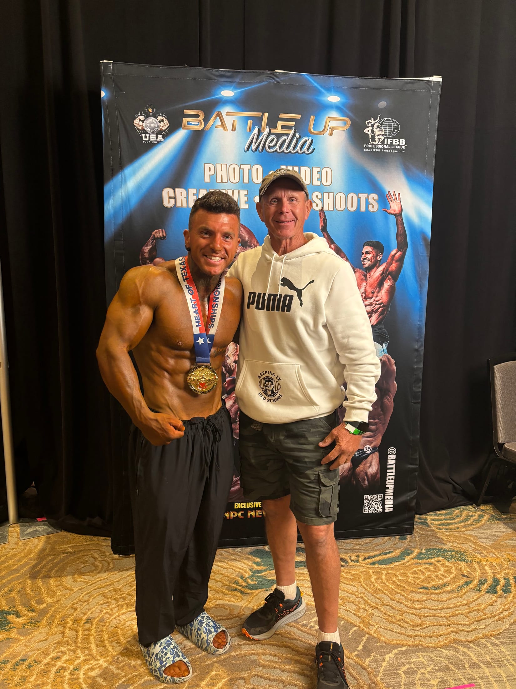 Lance celebrating a bodybuilding championship with his gold medal