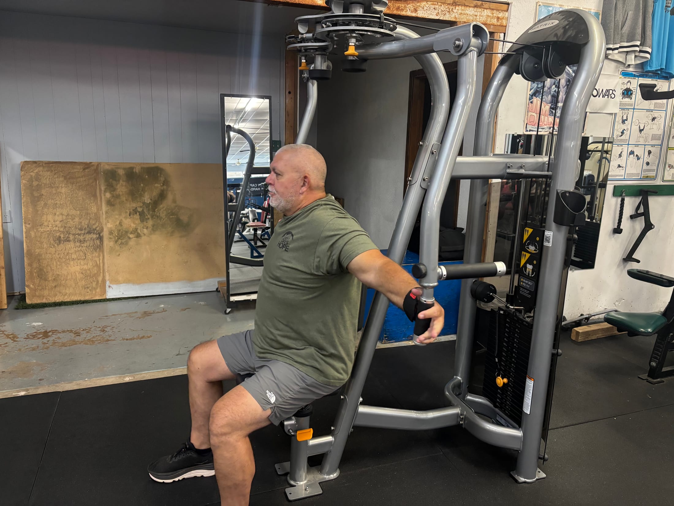 A member training on a chest machine